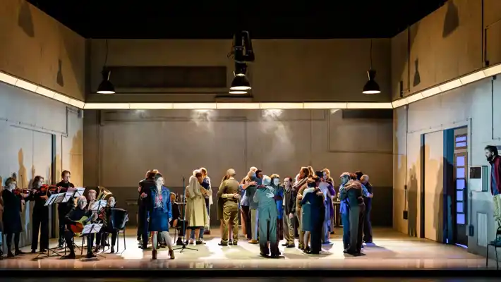 A group of people standing on top of a stage.