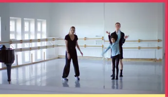 A woman, a young girl and a man try out moves together in a rehearsal room.