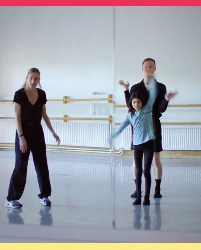 A woman, a young girl and a man try out moves together in a rehearsal room.
