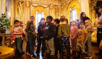 A group of people standing in a room.
