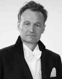 A close-up of a man wearing a tailcoat.